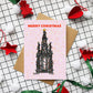 Scott Monument Edinburgh with Christmas lights around it on a Christmas card
