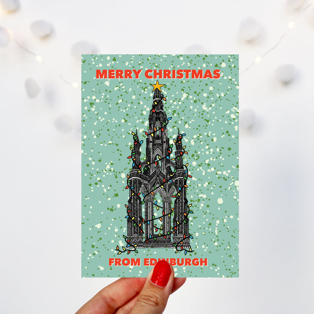 Scott monument on a Christmas card with fairy lights from Edinburgh