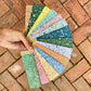 hand holding a fun selection of colour samples for hand painted frames
